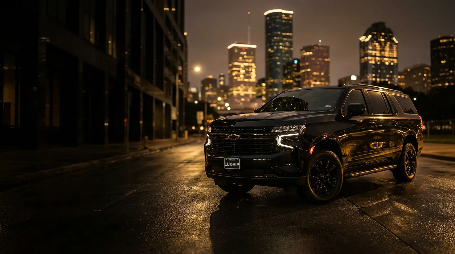 Lux VIP Limo black Chevrolet Suburban at night in downtown Houston